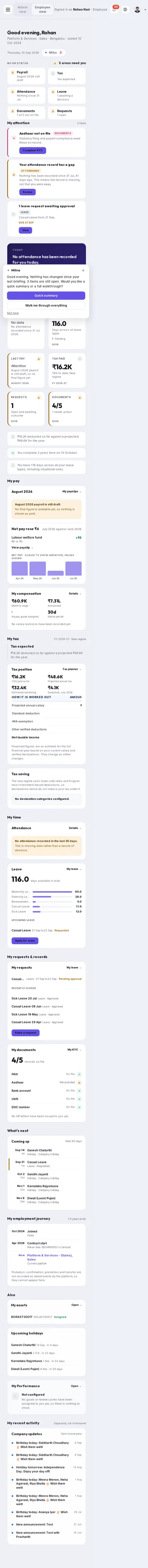 The BlueOneHR employee dashboard as it appears on the phone in the photograph